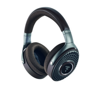Close-up of black over-ear headphones with teal accents and padded ear cushions, brand visible on the headband side