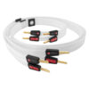 Coiled white Nordost audio cables with gold-plated connectors and black housings showing Nordost branding for high-quality audio setup