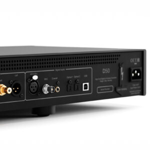 Rear panel of audio equipment with multiple input connectors (XLR, RCA) and a power inlet, viewed from the side.